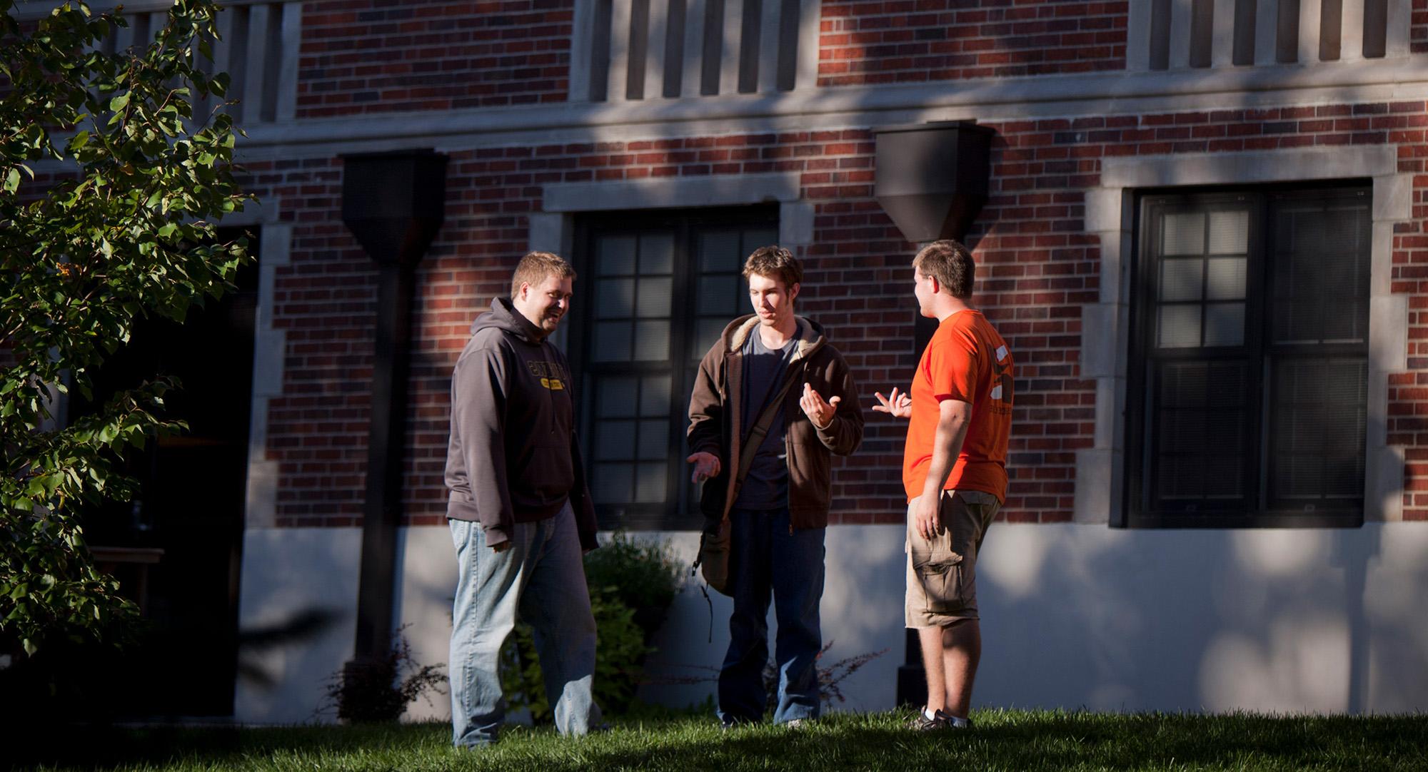 Students talking in front of Fees Hall.